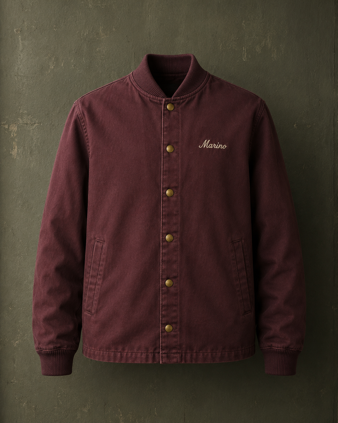 The Coach Jacket, faded oxblood cotton with cream chain-stitch embroidery.